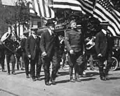 Men marching in a Memorial Day parade on Commercial Street, circa 1917